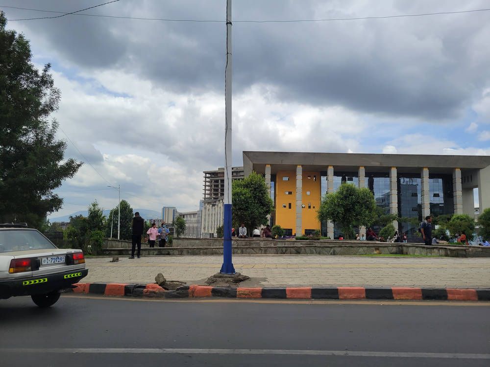 A building with a colonnade, from the car