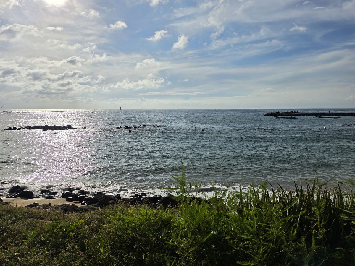 The breakwater, with a lighthouse out at sea