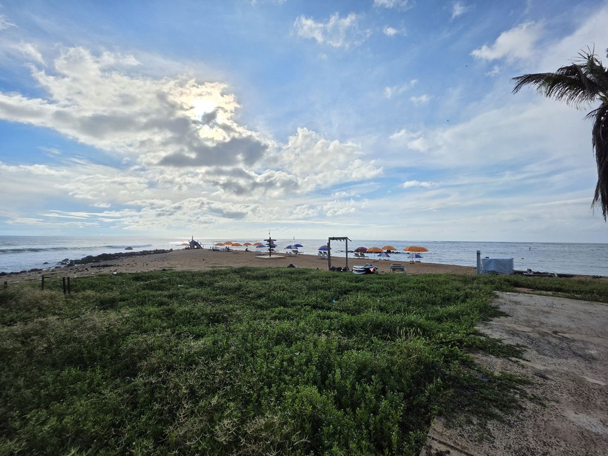 Umbrellas out toward the point