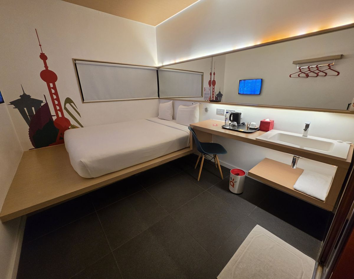 The room, with skylines painted on the wall