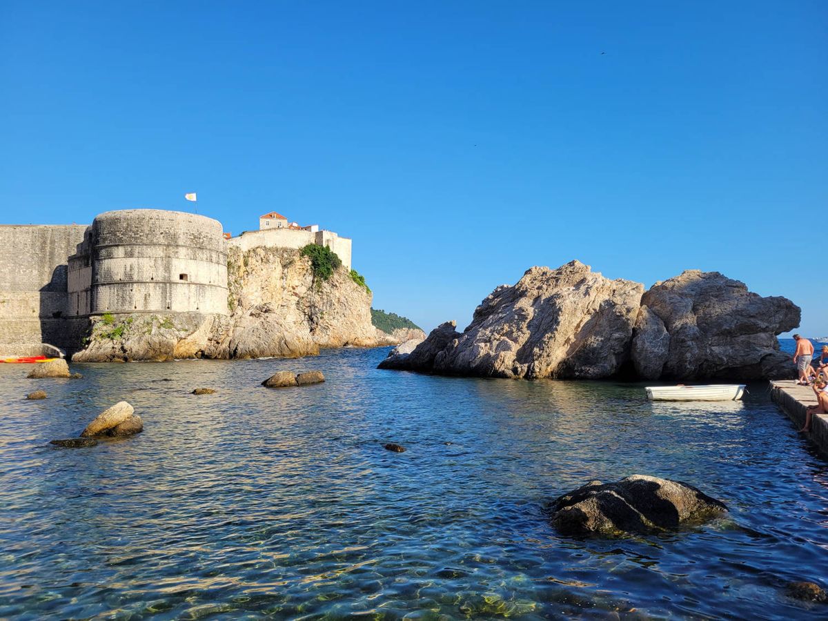 Rocks and the fortress walls at the water