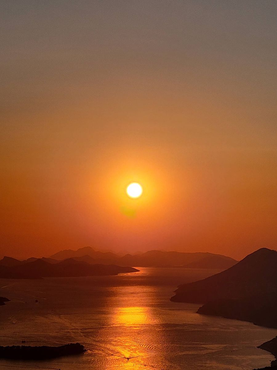 The sun in an orange sky