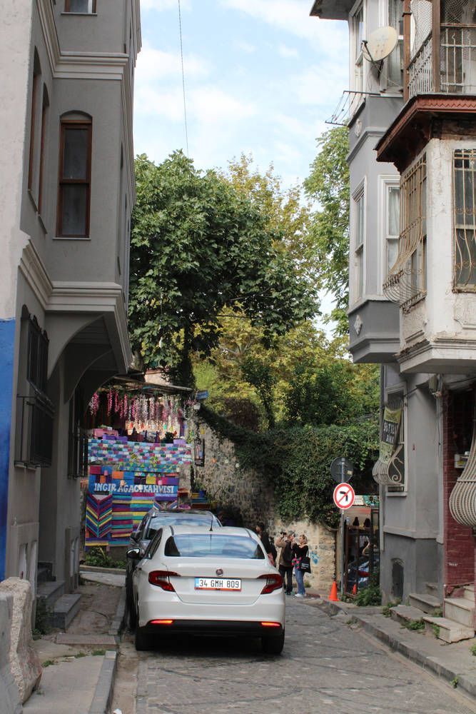A steep street toward a colorful stairway