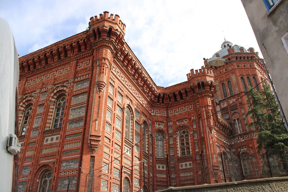 A red brick building with towers