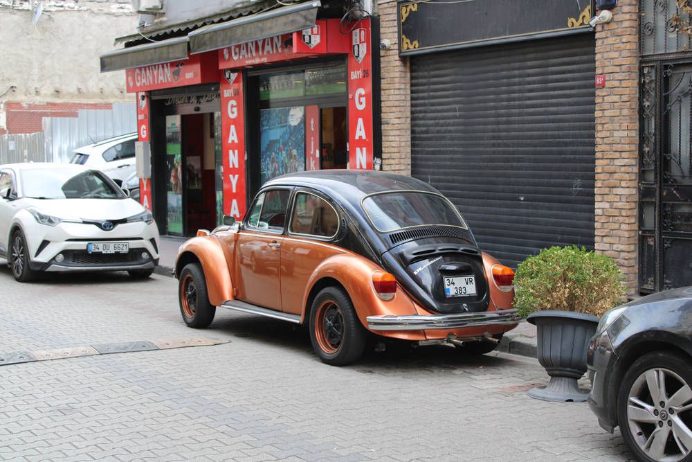 An orange and black Beetle