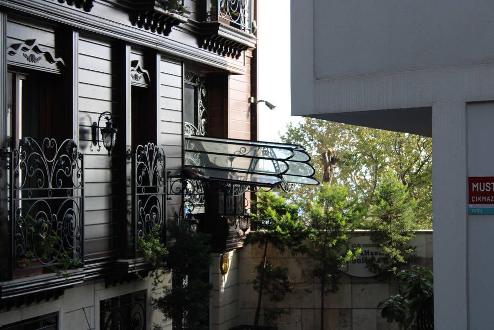 Dark wooden houses with iron balconies