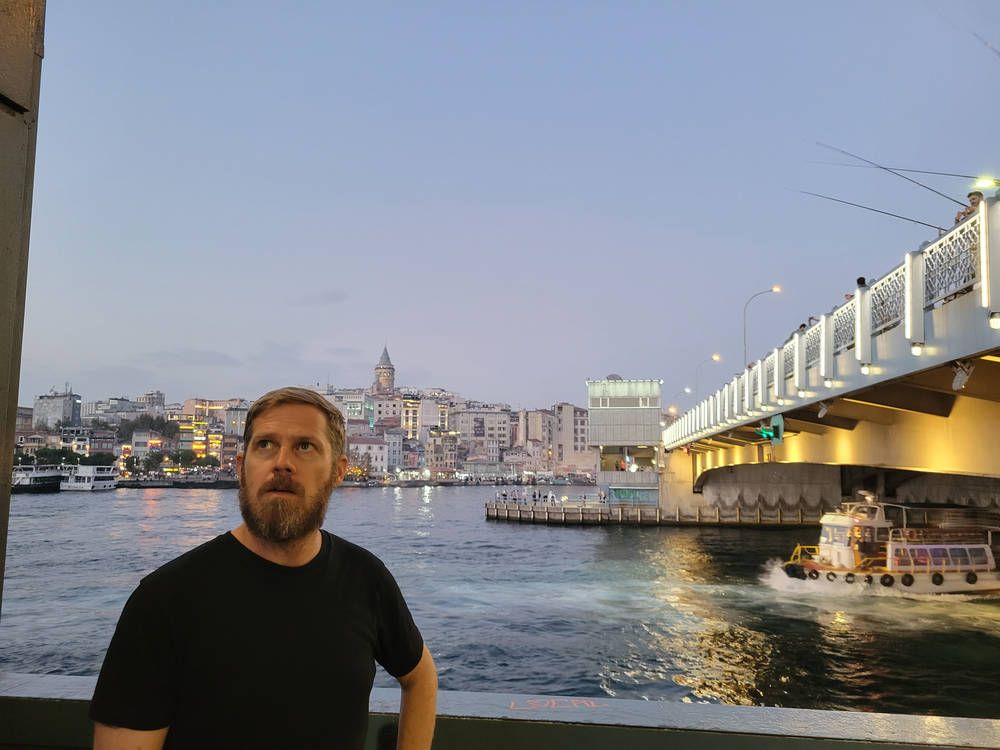 Brendan on the bridge at dusk
