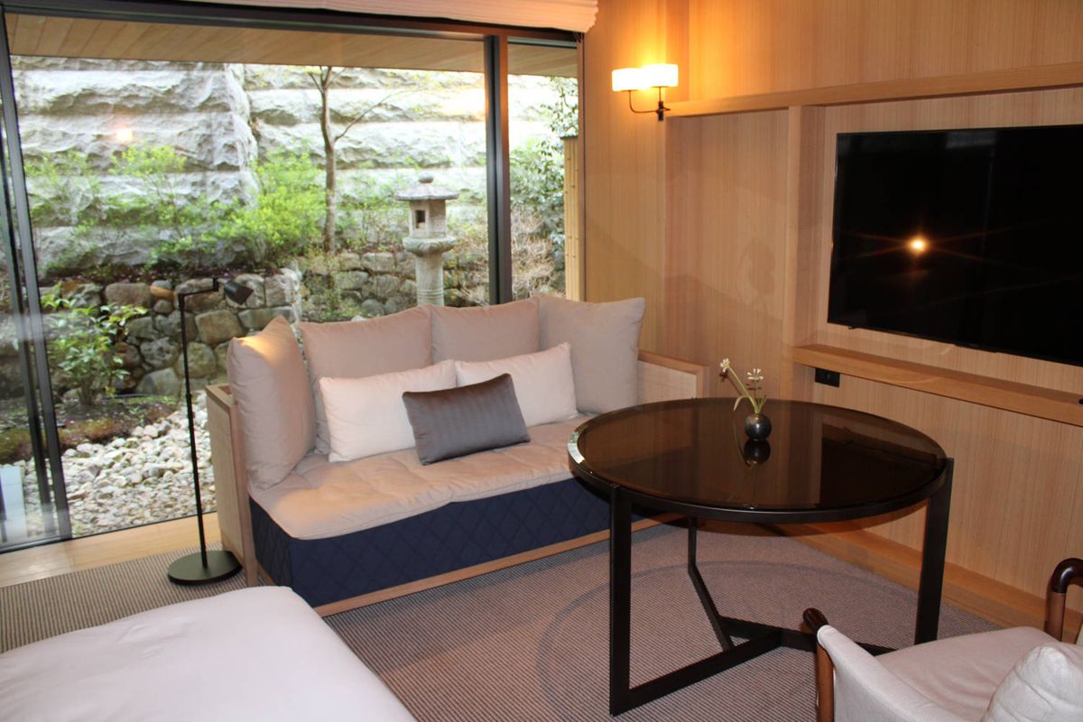 The sofa by the window, a stone lantern in the garden