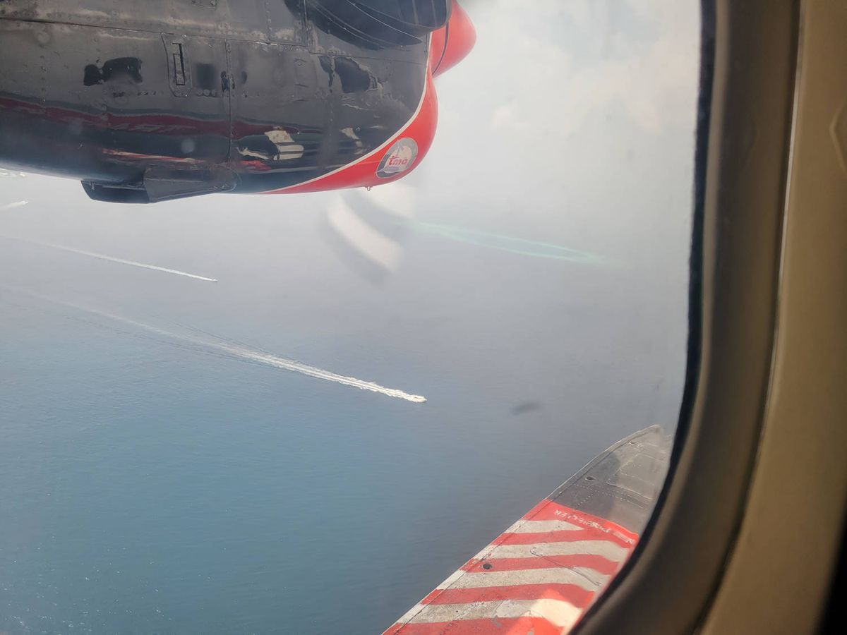 The seaplane float out the window over the sea