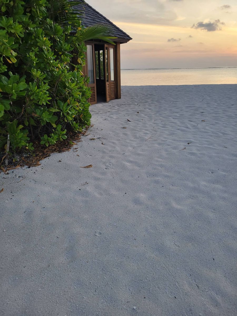White sand and a villa at dusk
