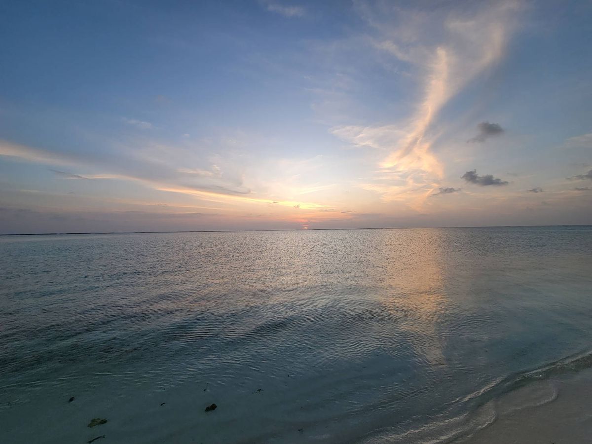 The sun going down over the water