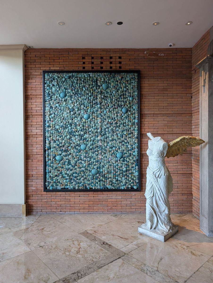 Shell art and a winged statue