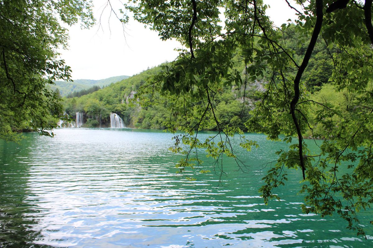A lake with falls in the distance