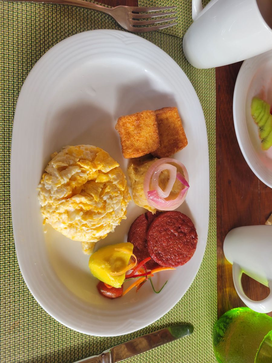 Breakfast: eggs, salami, fried cheese and mashed plantain