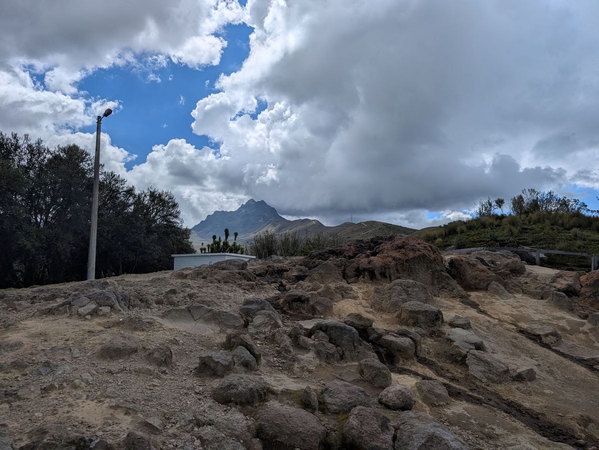 Volcanic rock, with a jagged peak beyond
