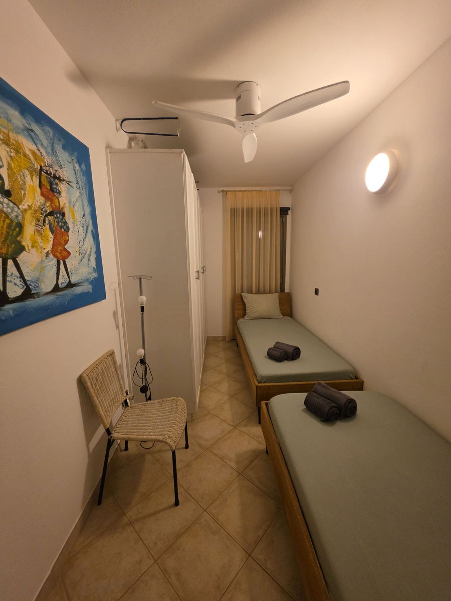 The second bedroom, with two single beds