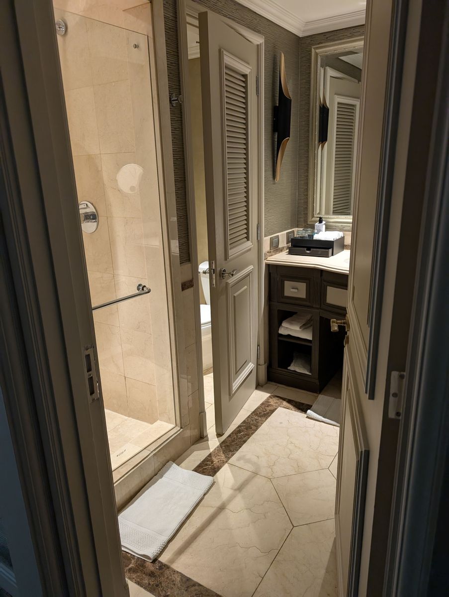 Marble bathroom with a separate shower and toilet room