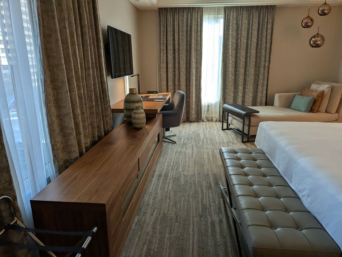 The long dresser and desk along the windows