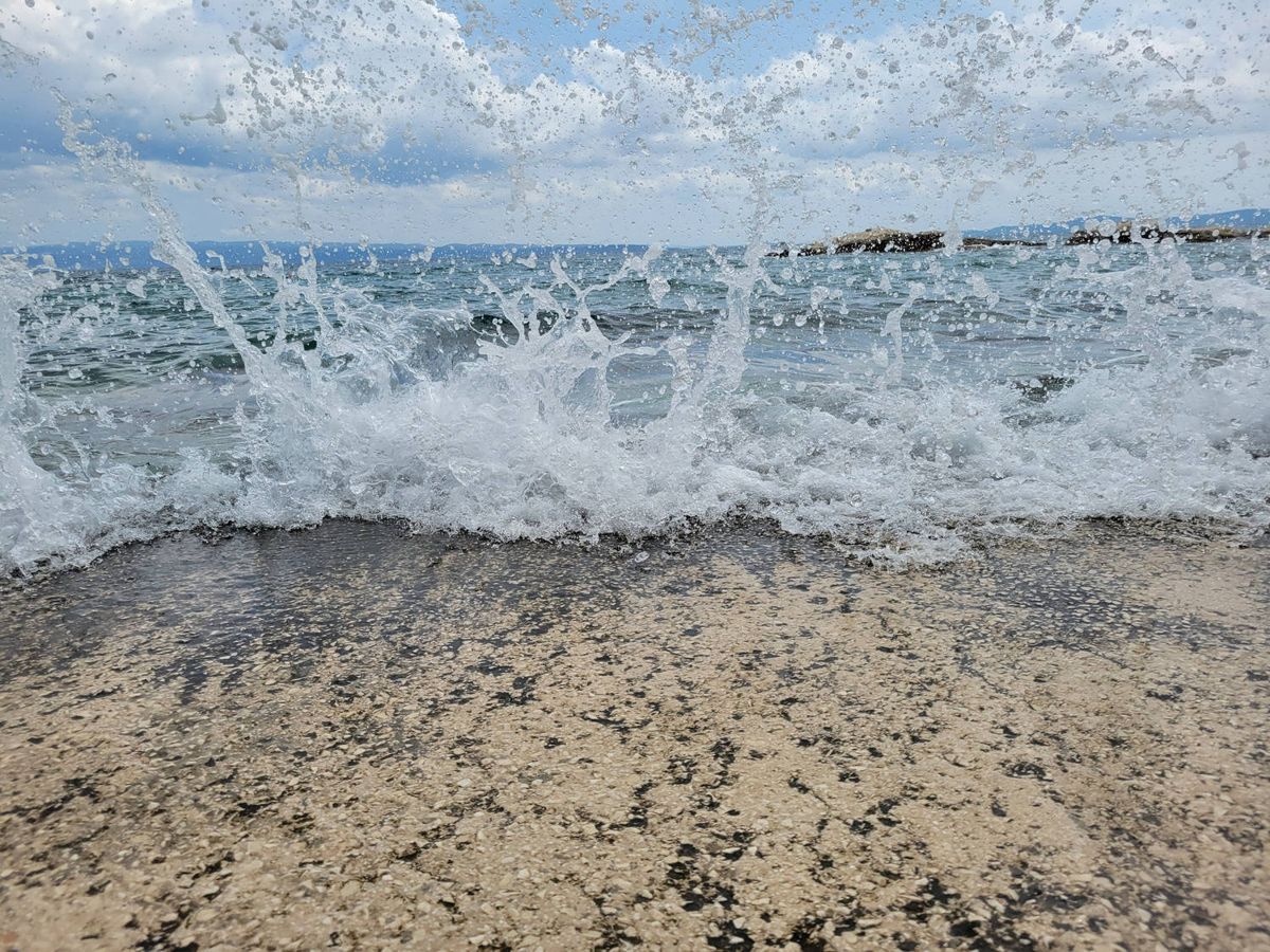 A wave breaking over the platform
