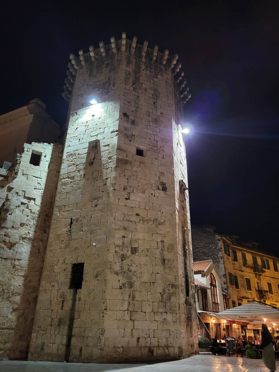 A stone tower at night