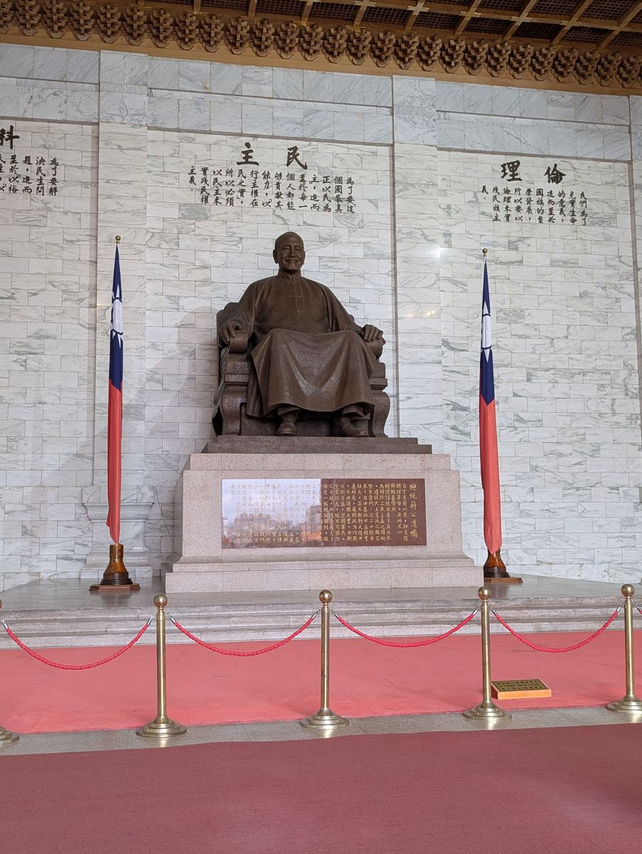 The bronze statue inside, under the words for science, democracy and ethics