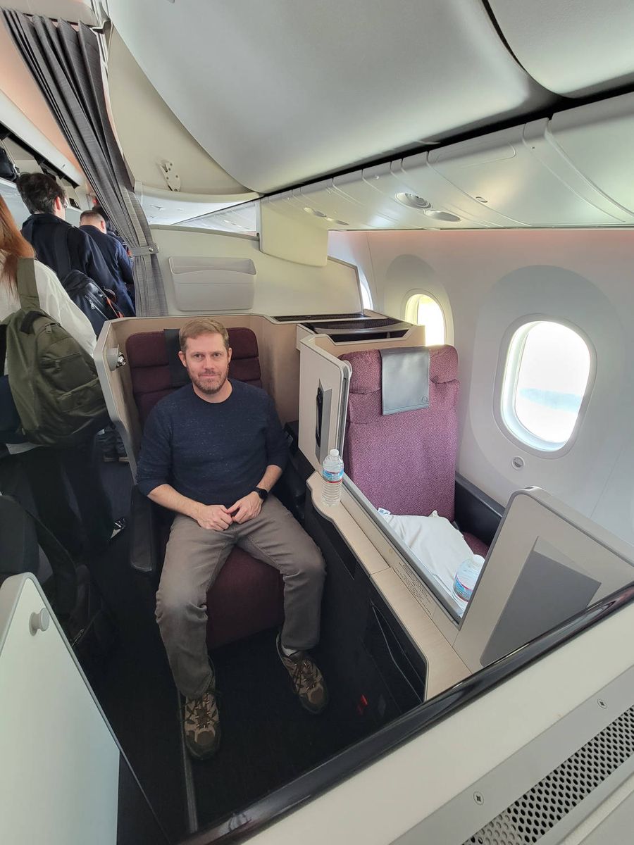 Brendan sitting in the window seat at boarding